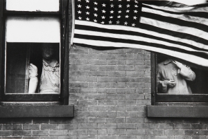 Rober Frank &#039;Parade, Hoboken, New Jersey,&#039; 1955. Silver gelatin print. Collection of the Vancouver Art Gallery, Gift of Claudia Beck and Andrew Gruft.