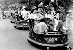 The comedian and film actor Fatty Arbuckle riding on The Whip at Luna Park, Coney Island, in a 1917 film.