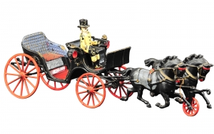 Rare Welker Crosby Barouche - Only known example, painted in black body, red flooring and blue backrest, a luxury styled toy with seated driver and drawn by two black horses sporting blue blankets. Provenance: Paul Dunigan Collection. 17” overall length. One loose wheel, (Near Mint Cond.) 