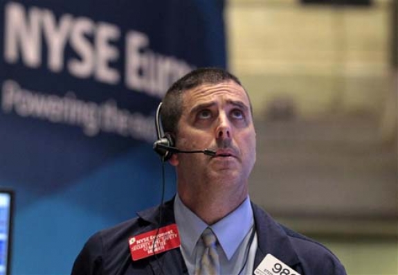 Who&#039;s worried? A trader on the floor of the New York Stock Exchange, 18 August