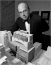 Thomas N. Armstrong III in 1985 with a model of the proposed addition to the Whitney museum by Michael Graves.