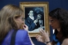 Head of Impressionist and Modern Art for Christie&#039;s London, Giovanna Bertazzoni (R) talks to media about Pablo Picasso&#039;s &#039;&#039;Portrait of Angel Fernandez de Soto&#039;&#039; from 1903, during a media viewing for &#039;&#039;Juxtaposed: Masterpieces through the Ages,&#039;&#039; at Christie&#039;s in London June 14, 2010.