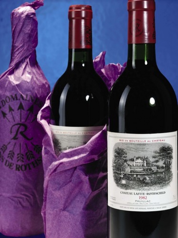 Three bottles of Chateau Lafite from the 1982 vintage. Wines from the first growth chateau in Bordeaux have been fetching record prices at auction, fueled by demand from Asian bidders.