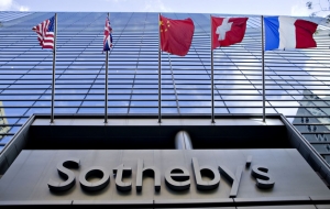 Flags fly outside Sotheby&#039;s in New York. 