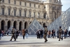 Uniformed police officers patrol the grounds at the Louvre. 
