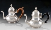 Two pear-shaped teapots. Left: Marked “IB”, unidentified; Right: unmarked. New York, or Albany, N.Y., 1740–1760. Silver, wood. The Art Museums of Colonial Williamsburg. Museum Purchase (1964-274 and 1964-275).