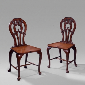 Pair of George III Mahogany Hall Chairs, c. 1760. 