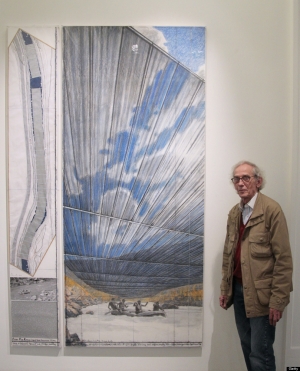 Christo poses next to one of his works as part of his exhibition &#039;Project for the Arkansas River, State of Colorado&#039; at the Guy Pieters Gallery in Paris. 