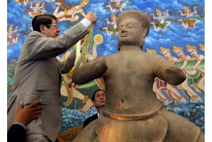 The 10th-century statue is presented at a ceremony in Phnom Penh on June 3, 2014.