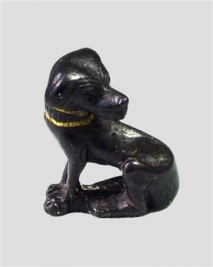 A Figurine of a dog made of bronze with a gold collar attributed to Tutankhamun&quot;s tomb, which was discovered by Howard Carter in 1922 in the Valley of the Kings is seen in this handout picture released on November 9, 2010.