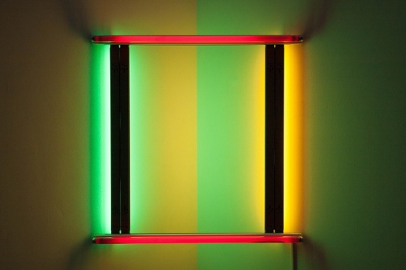 The exhibition includes works by Dan Flavin.