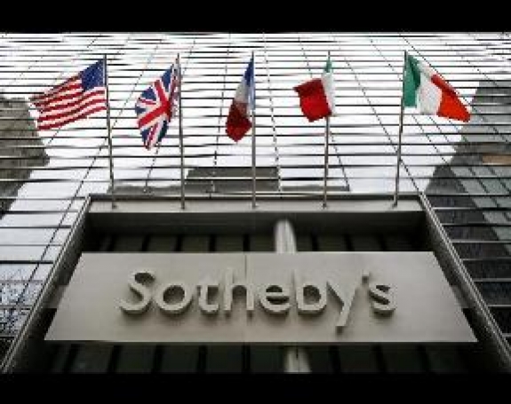 Flags fly outside Sotheby&#039;s in New York. 