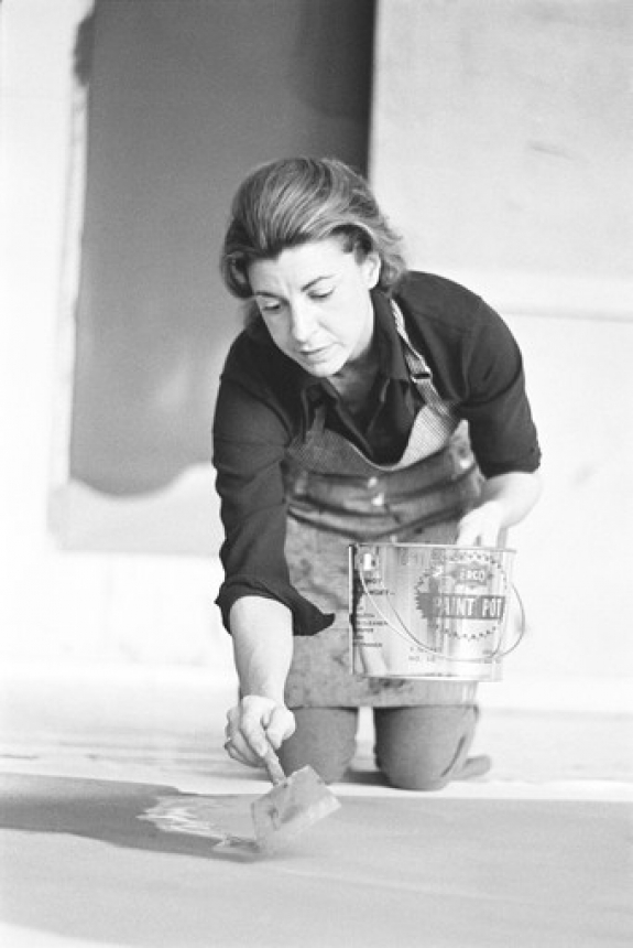 Helen Frankenthaler works on a large canvas in 1969. She was influenced by Jackson Pollock, whose drip-painting technique inspired her more deliberate pouring method.