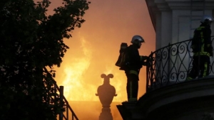 Firefighters battle the blaze at Hotel Lambert in Paris.