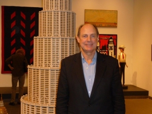 Monty Blanchard, president of the American Folk Art Museum, at the museum&#039;s outpost near Lincoln Center for the Performing Arts. He&#039;s standing by &quot;Encyclopedia Palace of the World,&quot; by Marino Auriti, created in the 1950s.