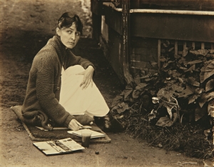 Alfred Stieglitz photograph of O&#039;Keeffe with sketchpad and watercolors, 1918.