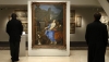 Visitors view the Charles Le Brun painting that was found at the Ritz in Paris while it was on view at Christie's in January 2013.
